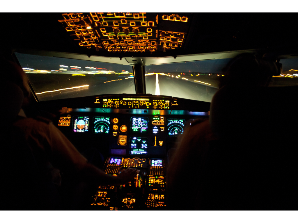 Flight taking off from a runway at night